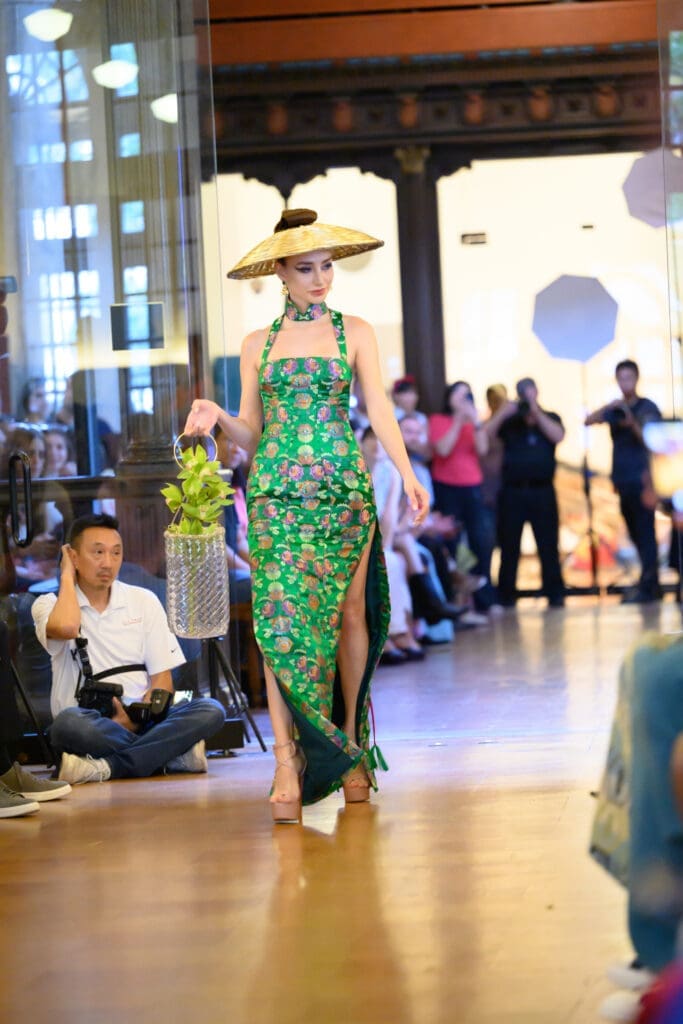 Chloe Dao's green pattern dress modeled by Irina Borodina at the Ascend AAPI Spring Fashion Show (Photo by Ken Jones)