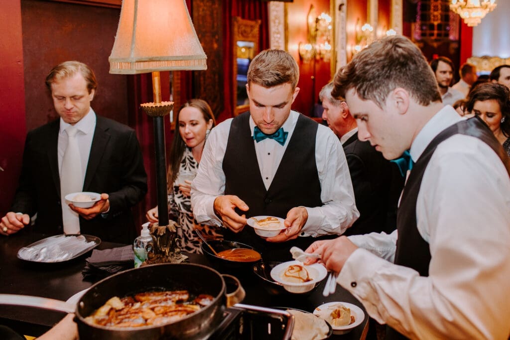 Guests at the Flambe station. (Photo by Ali Minetree)