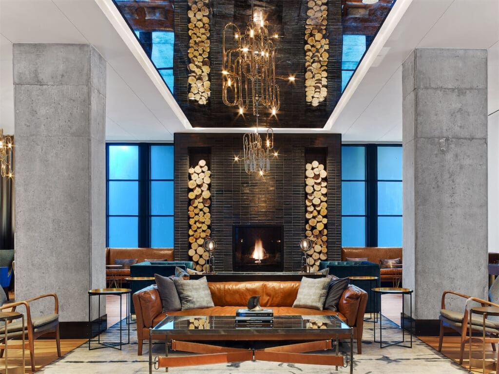 Hotel Van Zandt's design boasts chandeliers made from French horns, flying bird art made of vinyl, framed replicas of vintage posters, and more nods to its musical theme.
