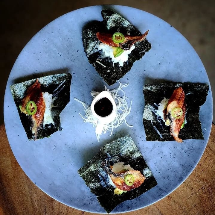 Hitsuma Chips with freshwater eel, toasted nori, parmesan cheese, sushi rice, avocado, serrano, chili soy glaze. (Photo by Maria Diss)