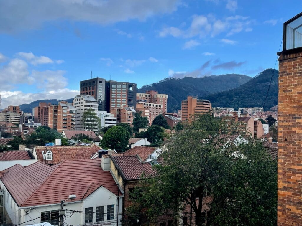 A lofty rooftop view of Quinta Camacho, the city of Bogotá beyond, and the Andes Mountains. (Photo by Cole Von Feldt)