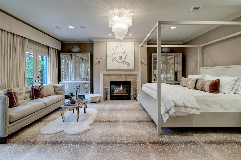 The primary bedroom in the luxurious 'Tuscan Villa' townhome at 5722 Logan Lane (Photo by TK Images/Compass)