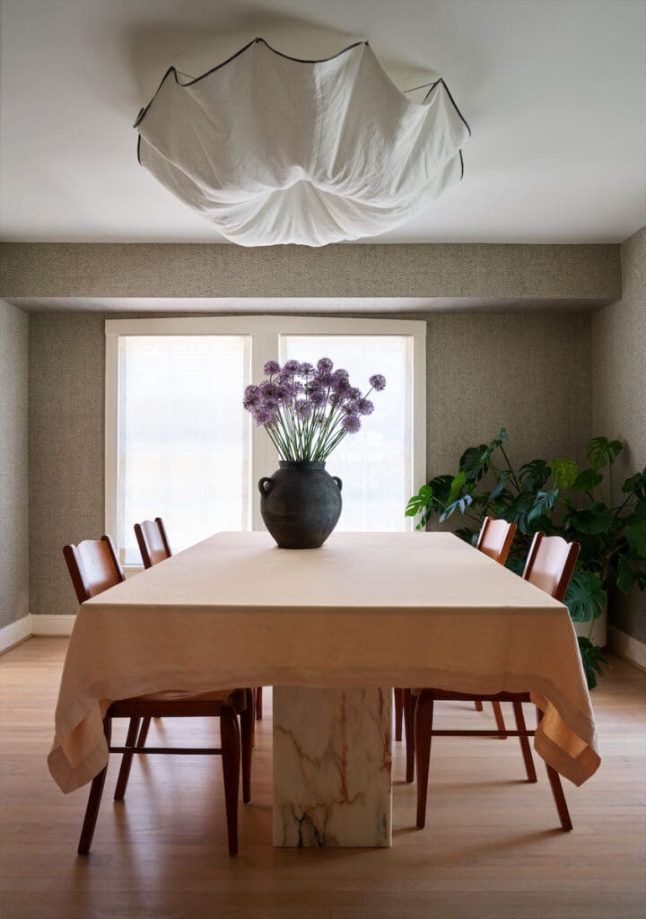 Custom table in marble from Aria Stone Gallery. Philippe Starck prototype chairs. Rare 1980s Celestia light pendant Tobia Scarpa for Flos. (Photo by Pär Bengtsson)