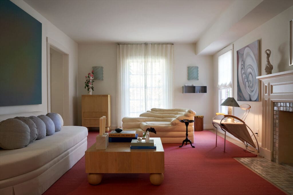 In the living room of Olivia Persia’s Houston house, a 1970s de Sede settee in Holly Hunt leather, Ron Rezek sconces, and a custom chest designed by Olivia Persia. Stool is a
collaboration between fashion designer Bode and Green River Project. Shelf Jonathan Nesci. Custom carpet Carol Piper Rugs. (Photo by Pär Bengtsson)