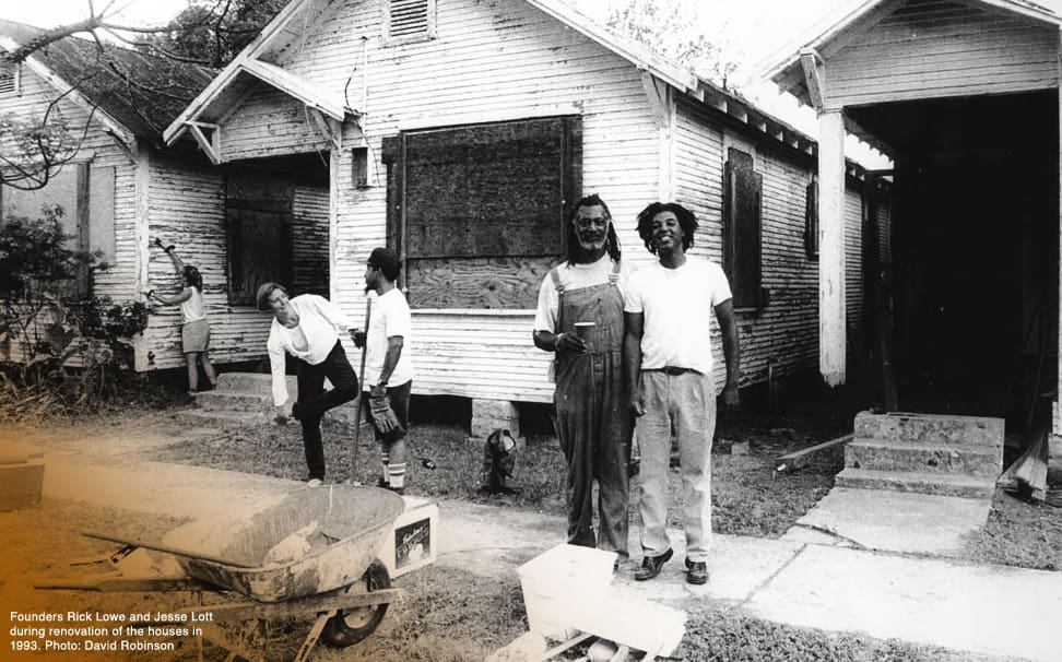 Project Row Houses co-founders Jesse Lott and Rick Lowe in front of the row houses which eventually became Project Row Houses in 1993. Project Row Houses, now led by executive director Eureka Gilkey, is celebrating its 30th Anniversary this year. (Photo by David Robinson, courtesy Project Row Houses, Houston)