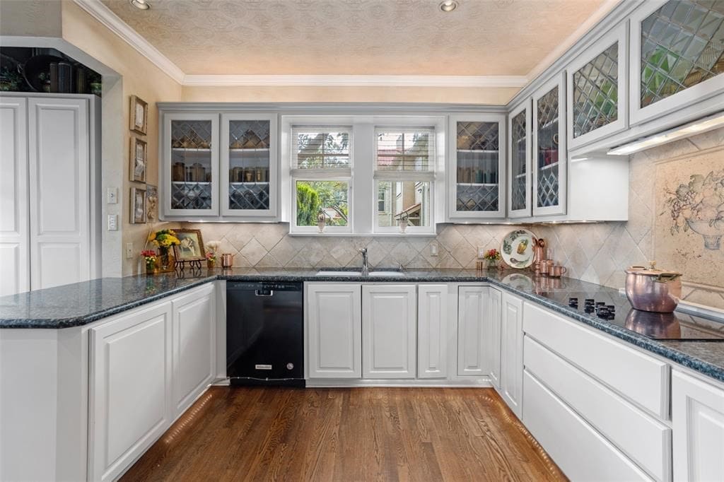 Etched glass cabinet fronts mirror the homes diamond grid cottage windows.