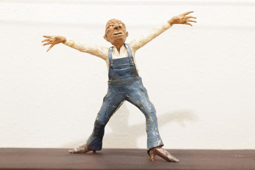 Jesse Lott's expressive papier-mâché sculpture from the "Men in Overalls" series. Papier-mâché was just one of the materials Lott often employed. (Courtesy Station Museum of Contemporary Art, Houston)