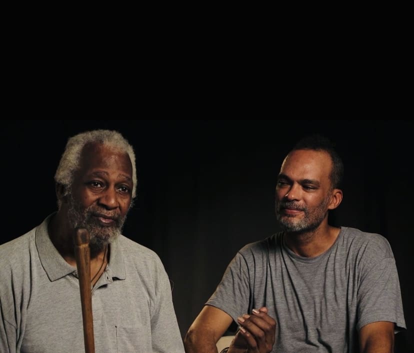 Jesse Lott and his son Vida Lott appeared in the documentary "Jesse Lott: Art & Activism," directed by filmmaker and 14 Pews founder Cressandra Thibodeaux. The documentary was shot by Thibodeaux and students from her film workshop. (Courtesy Cressandra Thibodeaux)