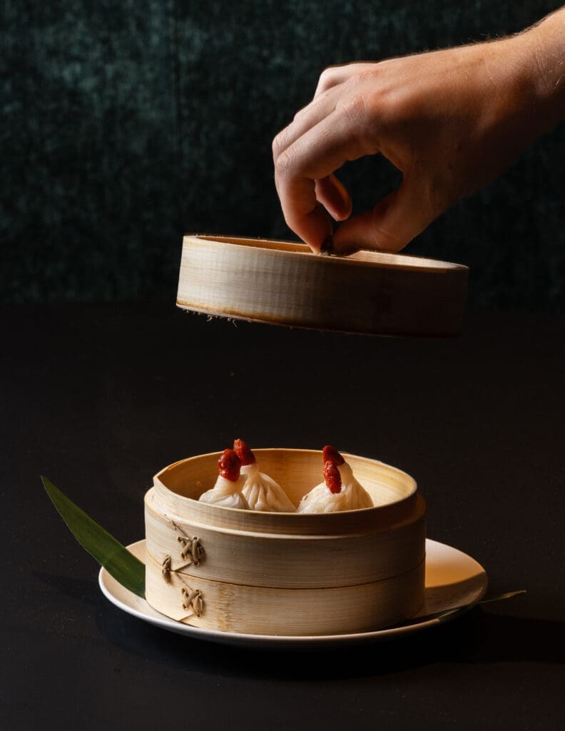 Starters include time-intensive XLB (Xiao Long Bao) soup dumplings, filled with minced pork and tiny cubes of gelatinized broth that melt as the dumplings are steamed. (Photo by Norton Creative )