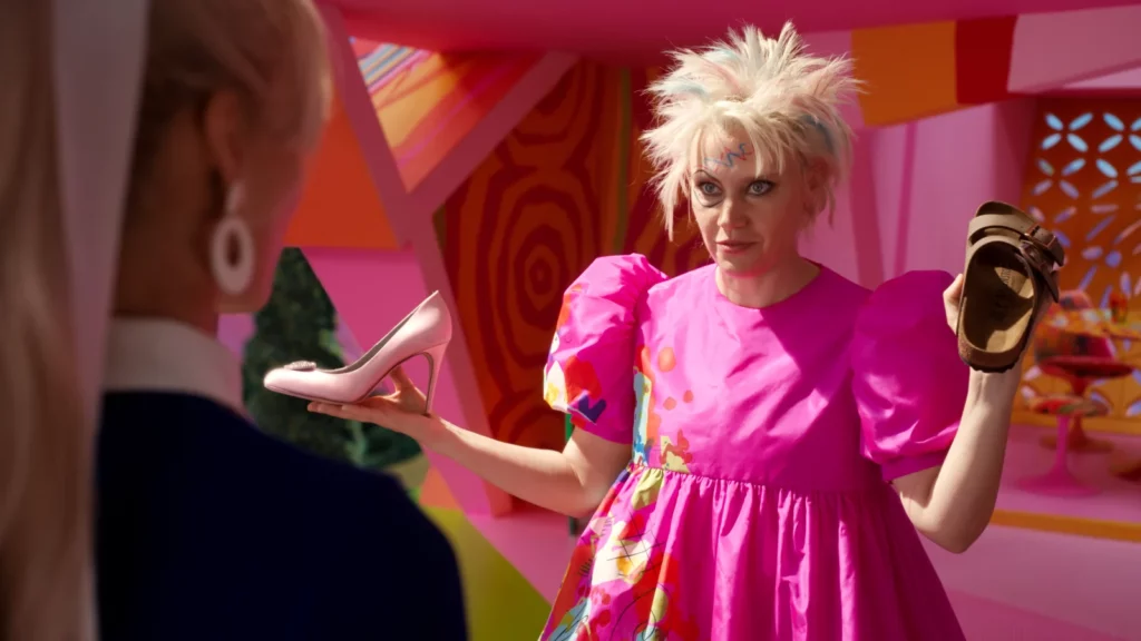 Kate McKinnon plays the well-worn gymnast Barbie. We all had a Barbie like this!