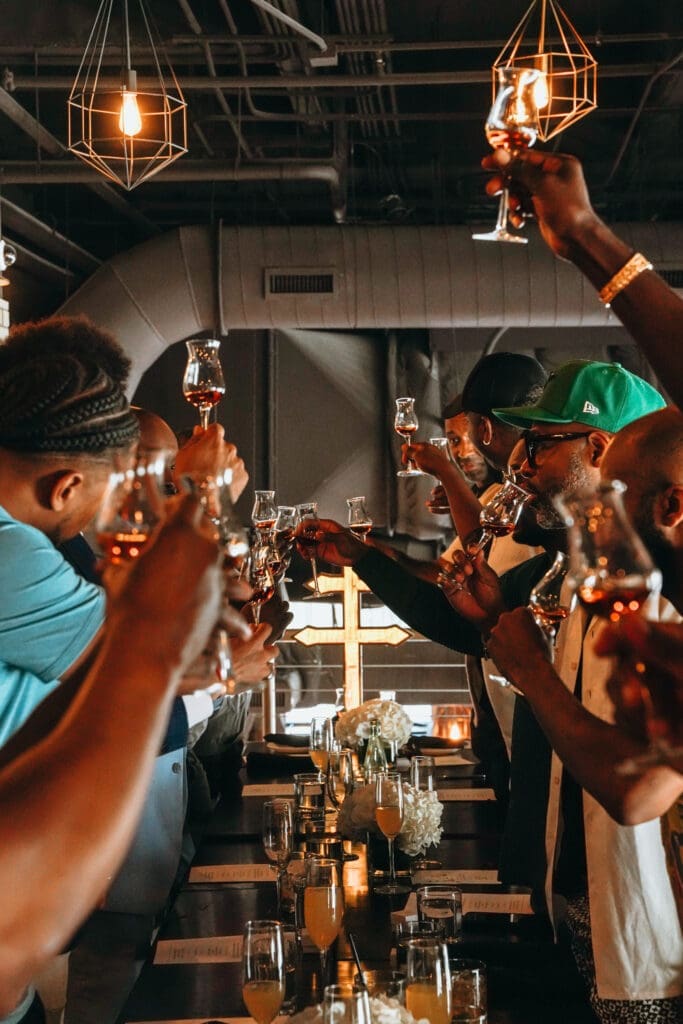 The gathering of fathers raise their glasses at the Father's Day and Juneteenth Brunch. (Photo by William Issac)