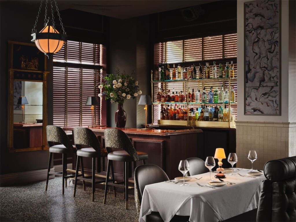 There are several dining rooms at Mister Charles, some offering a dark and moody vibe... (Photo by Douglas Friedman)