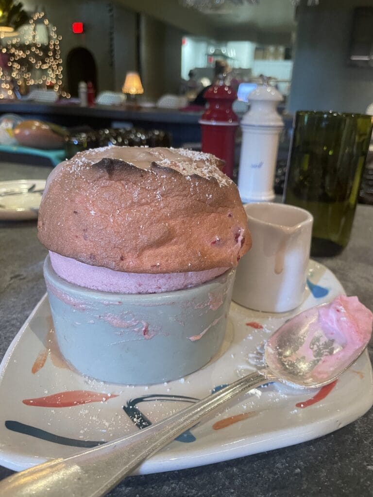 The strawberry souffle is served with a strawberry sauce at Rise.