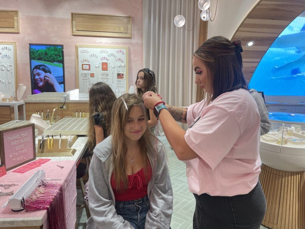 Annabelle Hawrylo, who came from Kingwood with her memaw Terri Pirdy, had tinsel strips put in her hair to celebrate the Barbie event at Kendra Scott.