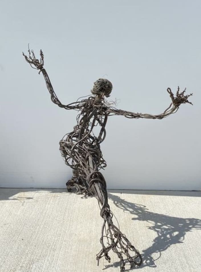Jesse Lott's "Running Man," 2008, formed from steel, copper, brass, and found objects embodies the artist's way with a wide range of often discarded materials. (Courtesy Deborah Colton Gallery, Houston)