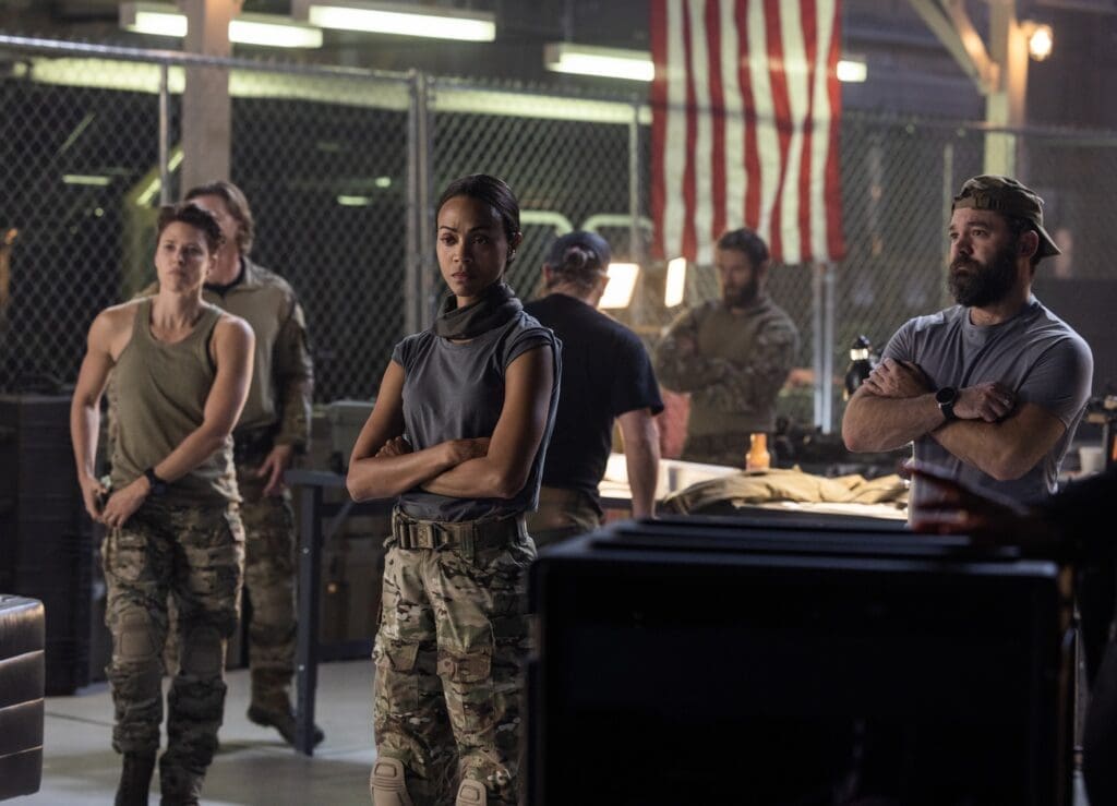 Jill Wagner as Bobby,  Thad Luckinbill as Kyle,  Zoe Saldana as Joe,  James Jordan as Two Cups, Jonah Wharton as Tex, Austin Hébert as Randy in Lioness episode 5, Season 1 streaming on Paramount+, 2023. (Photo by Greg Lewis/Paramount+)