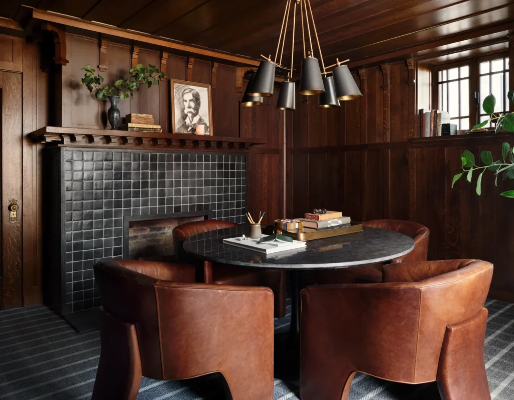 Plaid carpet and mod lighting add to the charm of the study. (Photo by Lisa Petrol)