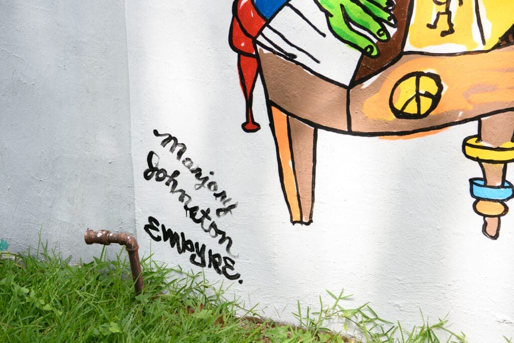 Marjory Johnston and Carlos Alcaraz (Empyre) signatures on the "Don't Be Scared" mural (Photo by Saranna Zhang/Kevin Zhang Photography)
