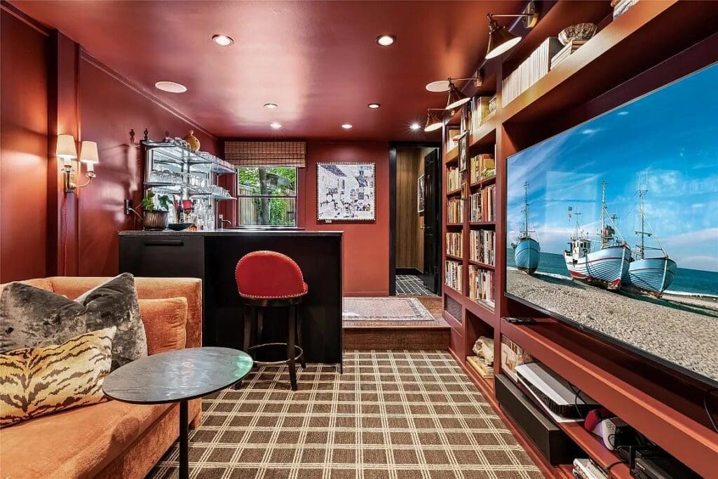 The built-in-lined library features a sizable wet bar. 
