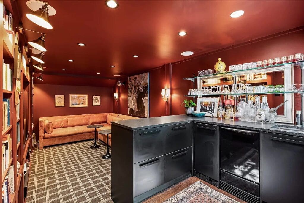 The built-in-lined library features a sizable wet bar. 