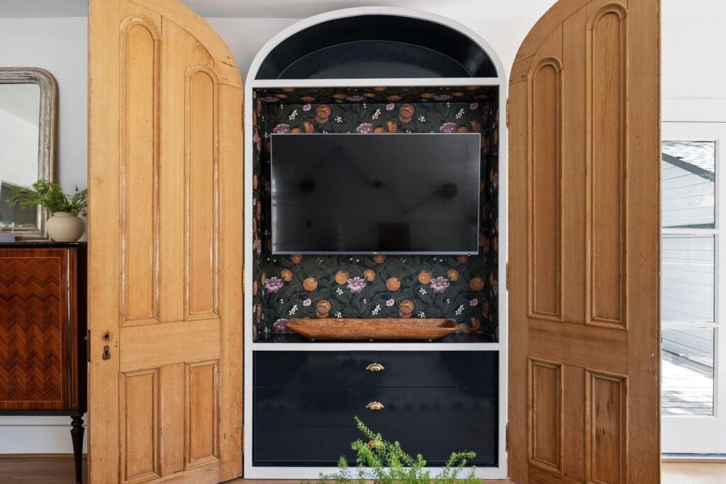 Attention to detail such as the hidden television in the living room at 1635 Hawthorne in Houston's Montrose neighborhood. (Photo by Josh Gremillion for Martha Turner Sotheby's International Realty )