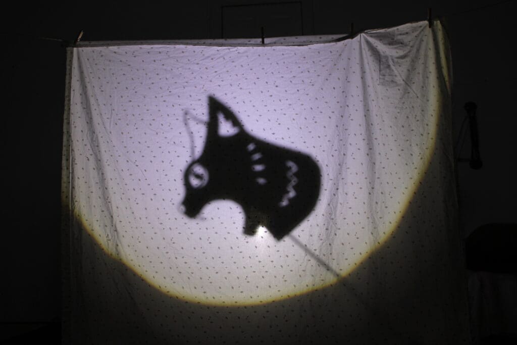 "Sweet Trip" used shadow puppets to illustrate the bugs' journey through the forest and mountains, one filled with dangerous obstacles (Photo by Ethan Bard)