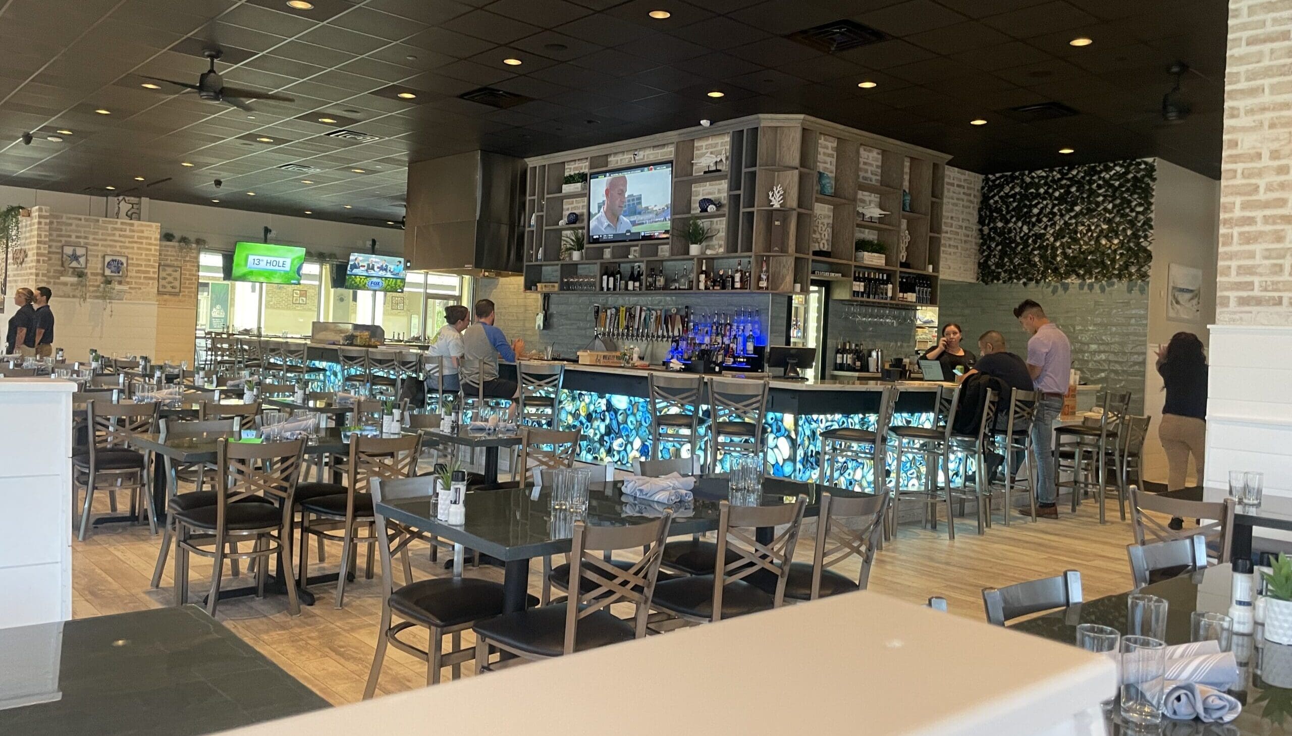The light and bright interior of Good Charlie's has booth, table and hightop seating available around seven TV screens.