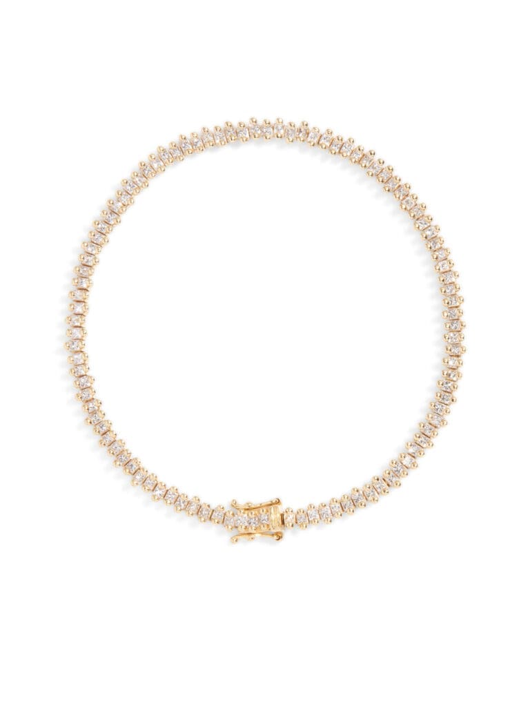 This Suzanne Kalan tennis bracelet features beautiful princess cut diamonds meticulously set in a slightly staggered formation all the way around the piece.