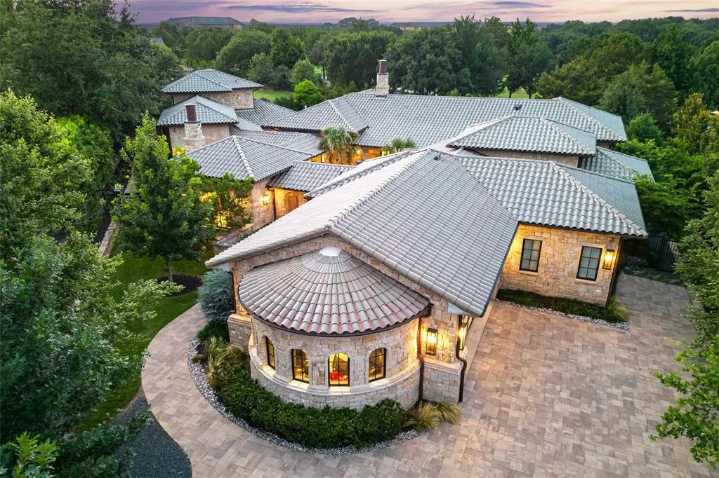 2006 Nighthawk Court brings a tile roof and stone facade.