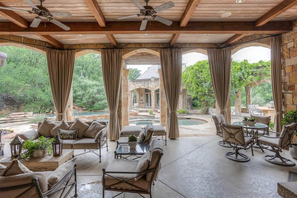 6901 Sanctuary Lane brings a covered patio with views across the wet area to the separate pool house.