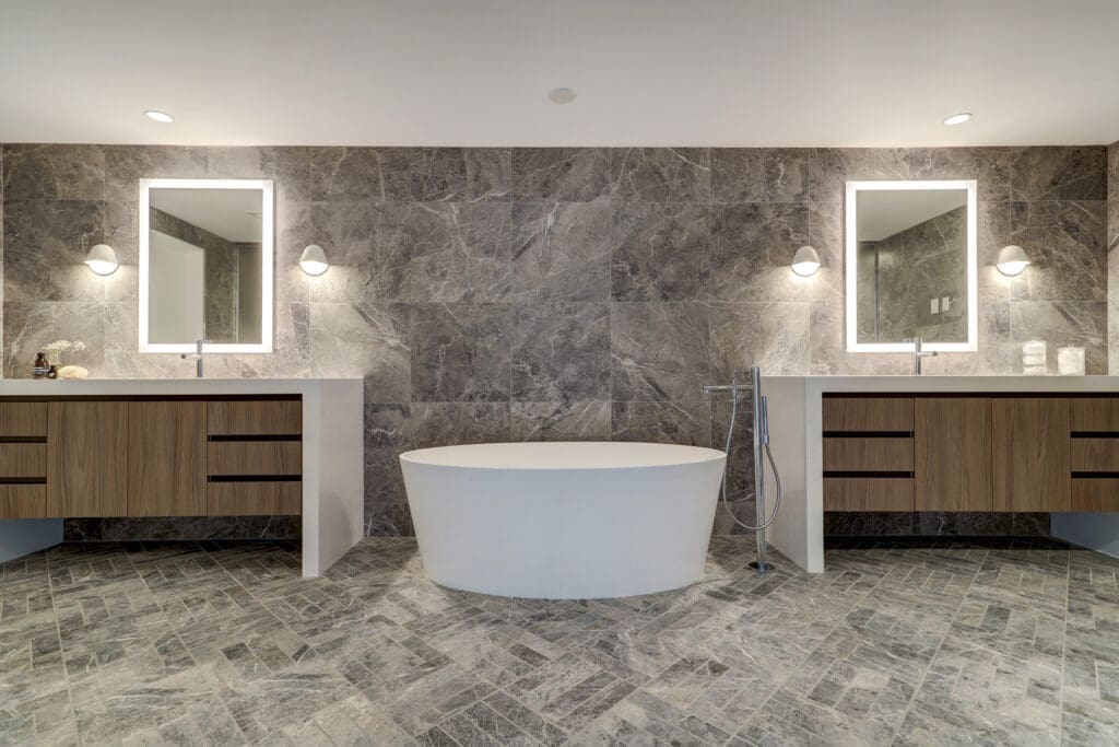 The downstairs primary bathroom is also a relaxing oasis.