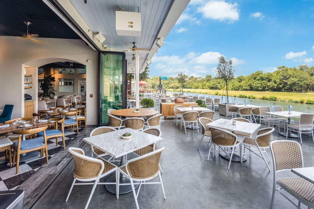 Satisfy your appetite and your love of nature on the Quince patio at WestBend.
