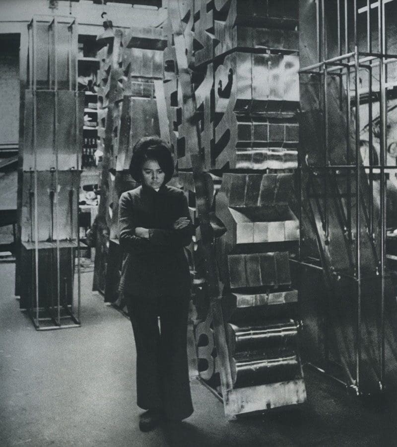 Chryssa appears in her Brooklyn studio with one of her most important neon artworks "The Gates to Times Square," 1964-1966. (Photo by Howard Harrison. Courtesy © The estate of Chryssa Vardea and Tate Modern)