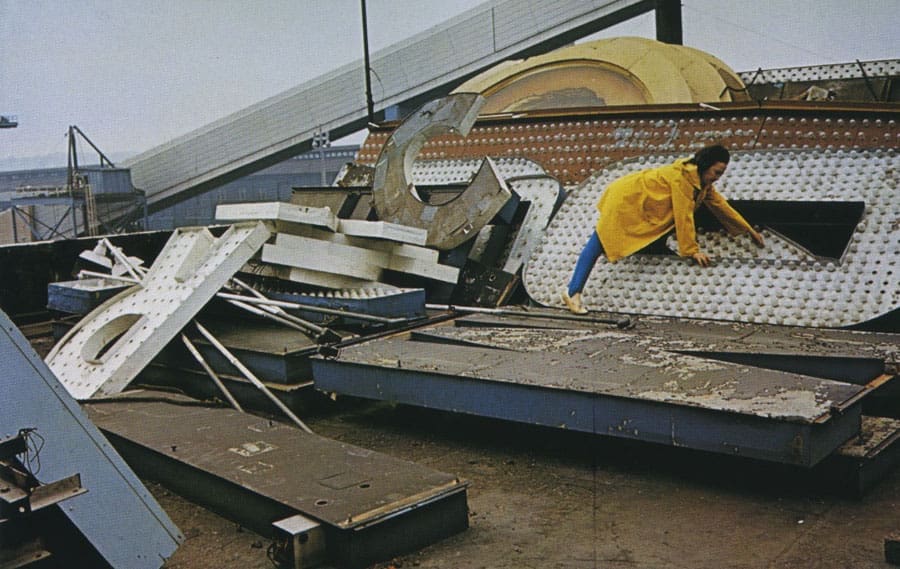 Pioneering neon artist Chryssa inspects vintage signage in 1965. (Photo by Adelaide de Menil. Courtesy Rock Foundation)