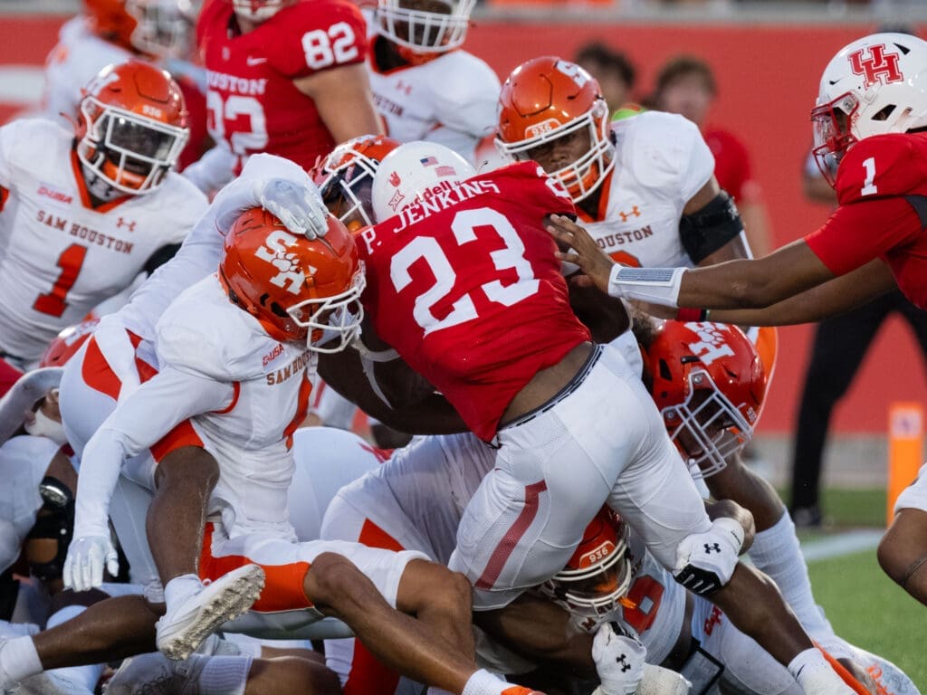 University of Houston freshman running back Parker Jenkins sometimes seemed to be taking on the entire Sam Houston team. And winning. (Photo by F. Carter Smith)