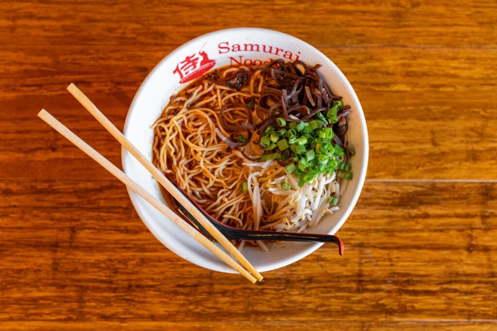 Steaming ramen noodles at the new Samurai Noodle location at the Lyric Market. Photo by Brandon Holmes.