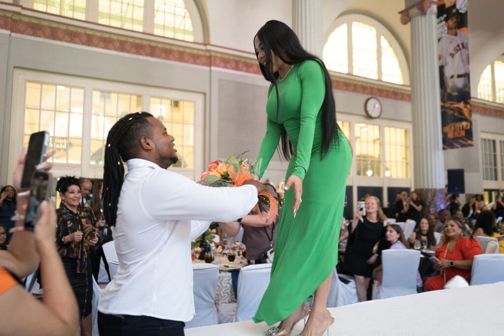 Astros pitcher Framber Valdez has flowers for his wife Isamal at the Astros' 'Champions for Healthy Families' luncheon at Union Station. (Photo by Daniel Ortiz)