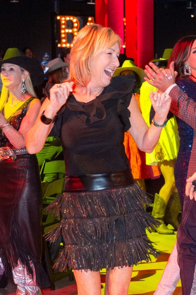 Shelley Boyer dances to Midland at the Houston Cattle Baron's Ball held at Post 713 Music Hall. (Photo by Jacob Power)