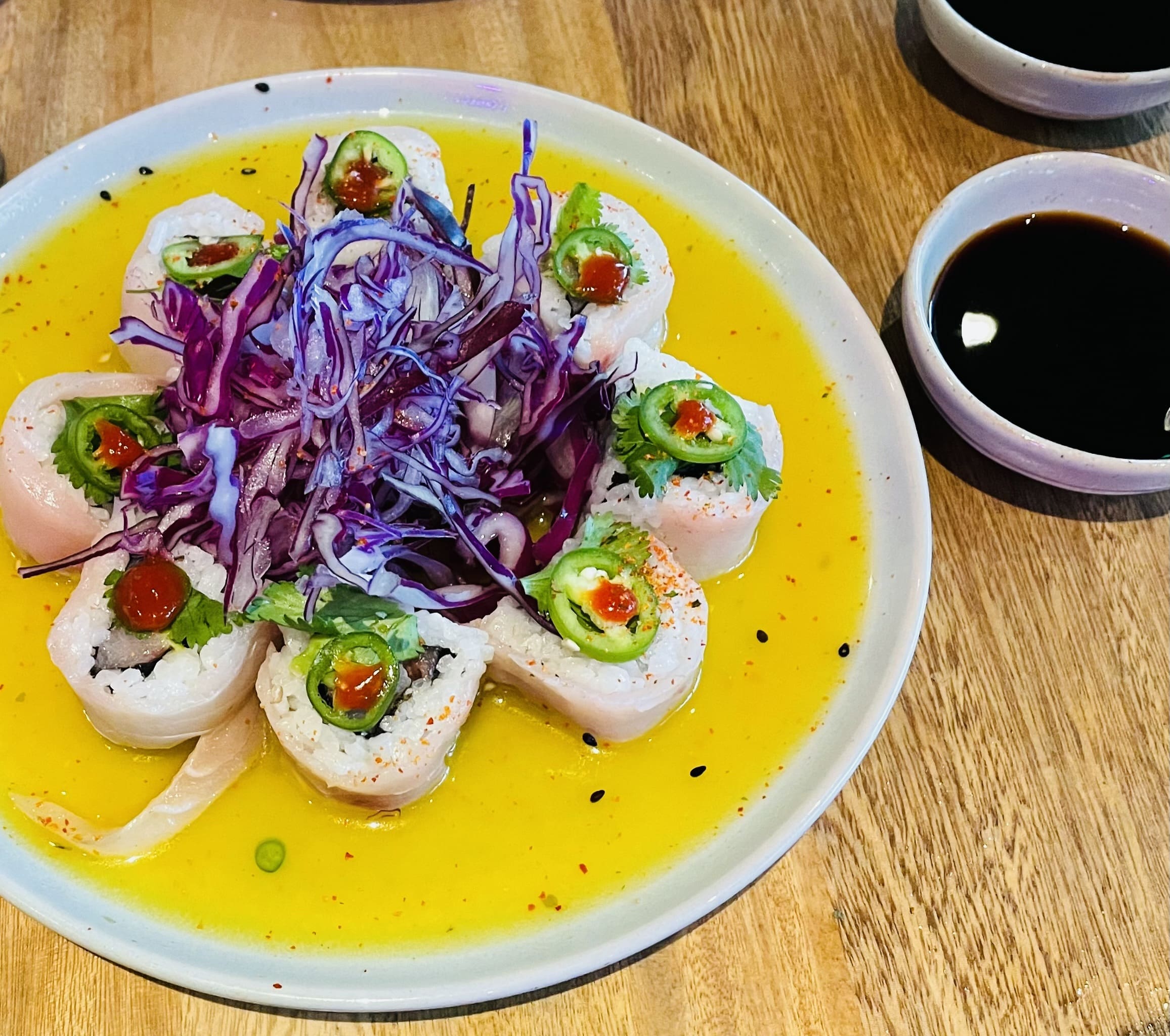 Behold the Frida roll at Quince served on a mirror of citrus sauce for a Latin twist. (Photo by Courtney Dabney)