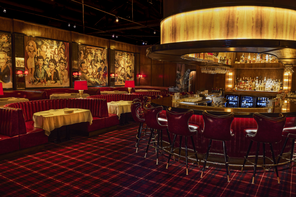 The murals at Drake's were inspired by those at Graydon Carter's celebrity NYC eatery, Waverly Inn. Here the Dallas caricatures were painted by Jenna Fredde. (Photo by Courtesy of Vandelay Hospitality)