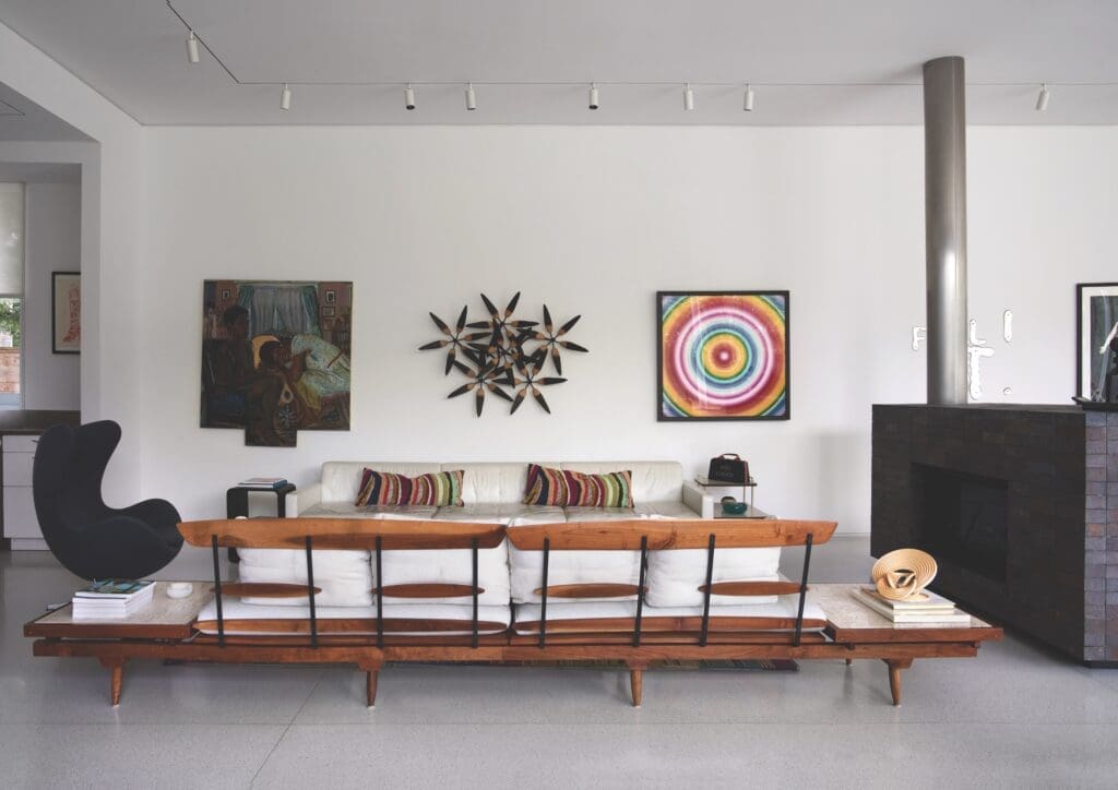Mid-century Phillip Lloyd Powell sofa bench. Vintage Arne Jacobsen Egg chair. Inga Kimberly Brown painting, James Surls wall sculpture. Rob & Nick Carter work on aluminum. On side table, Pro Choice handbag by Michele Pred. (Photo by Pär Bengtsson)