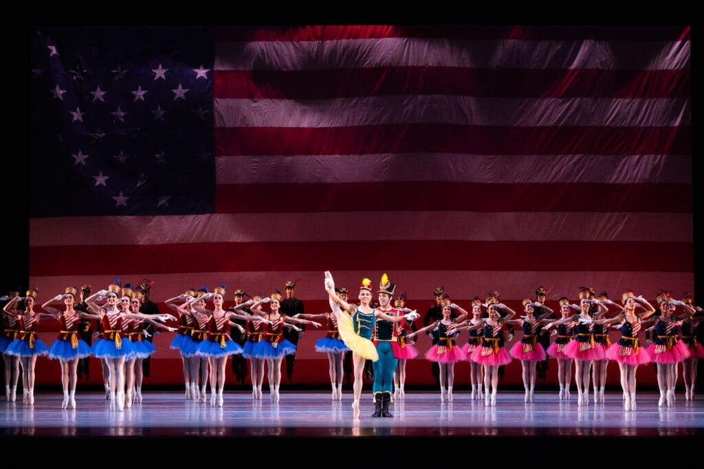 Houston Ballet first soloist Tyler Donatelli and principal Connor Walsh with artists of Houston Ballet in "Stars and Stripes."
Choreography by George Balanchine, © The George Balanchine Trust. 
(Photo by Lawrence Elizabeth Knox. Courtesy Houston Ballet)