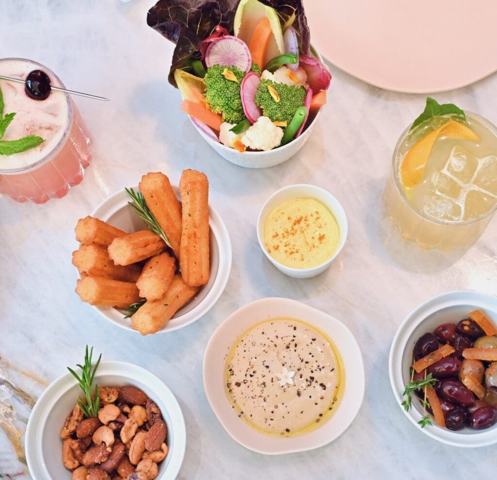 The new bar bites menu at Le Jardinier includes nine different bites such as marinated olives spiced with chili flakes and orange peel ($9) as well as toasted nuts tinged with cayenne pepper and fresh rosemary ($10). (Photo by Alex Montoya)
