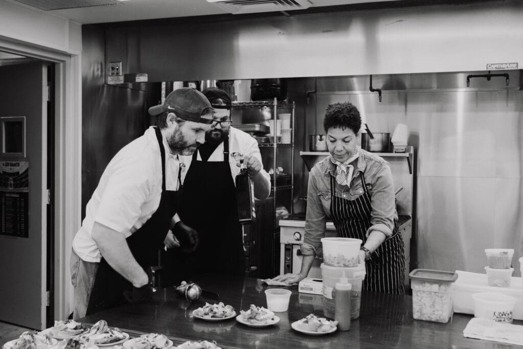 James Beard Award winning chef Nina Compton working in the kitchen on the French dinner at NOAG.  (Photo by MoDavisPhotography.com)