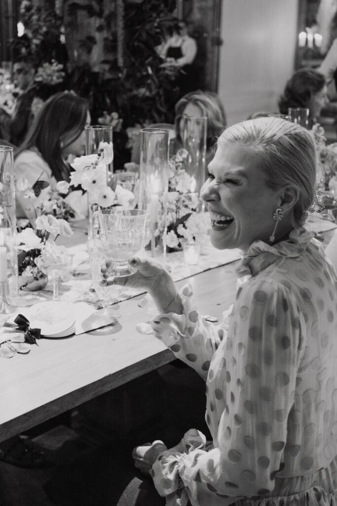 Bettina Bennett of Princeton, New Jersey,  raises a glass during the Versailles-inspired dinner at New Orleans Auction Galleries.