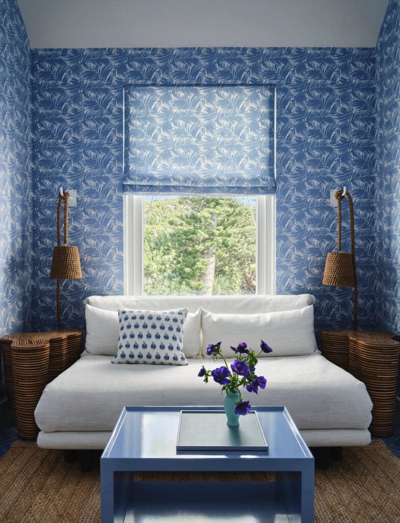 The carriage house’s wallcovering is custom by Meg Braff Designs. Ligne Roset sofa bed, Giorgetti side tables, Palecek lights. (Photo by Douglas Friedman)