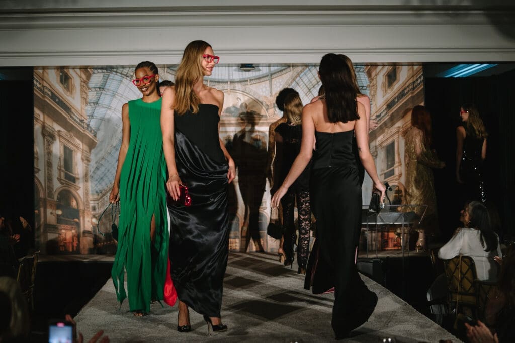 Neiman Marcus models wearing iconic red glasses on the catwalk  at the Houston Italian Cultural and Community Center Fall Luncheon. (Photo by Johnny Than)