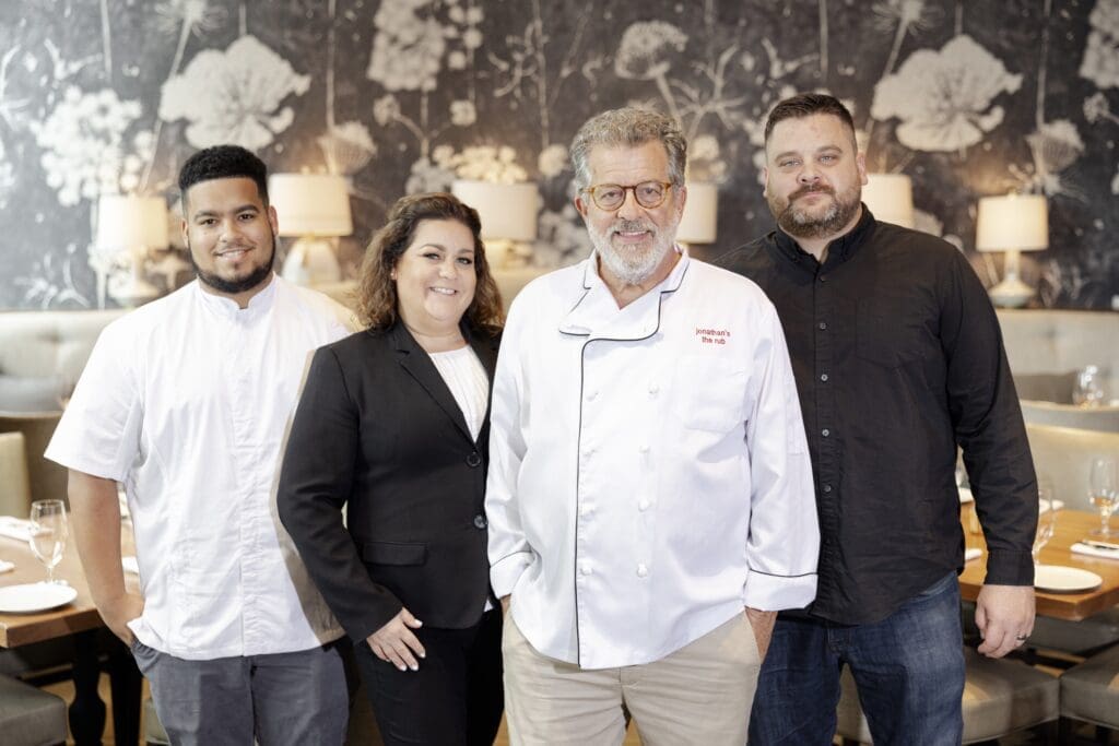 It's all in the family.. The Levine restaurant family includes Jay Forrest (Jonathan’s grandson who recently graduated from Culinary Institute of America), Jessica Levine (daughter who runs Memorial Green location), Jonathan Levine (founder and owner), Sam Levine (son who runs Campbell Place location). (Photo by Lauren Holub )