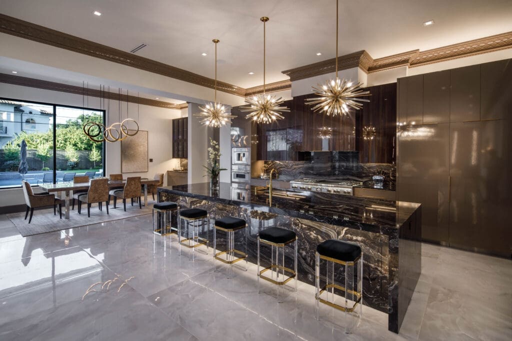 A state-of-the-art chef's kitchen, both sophisticated and functional equipped with high-end appliances, ample storage and stunning porcelain floors. (Photo by Steve Chenn)
