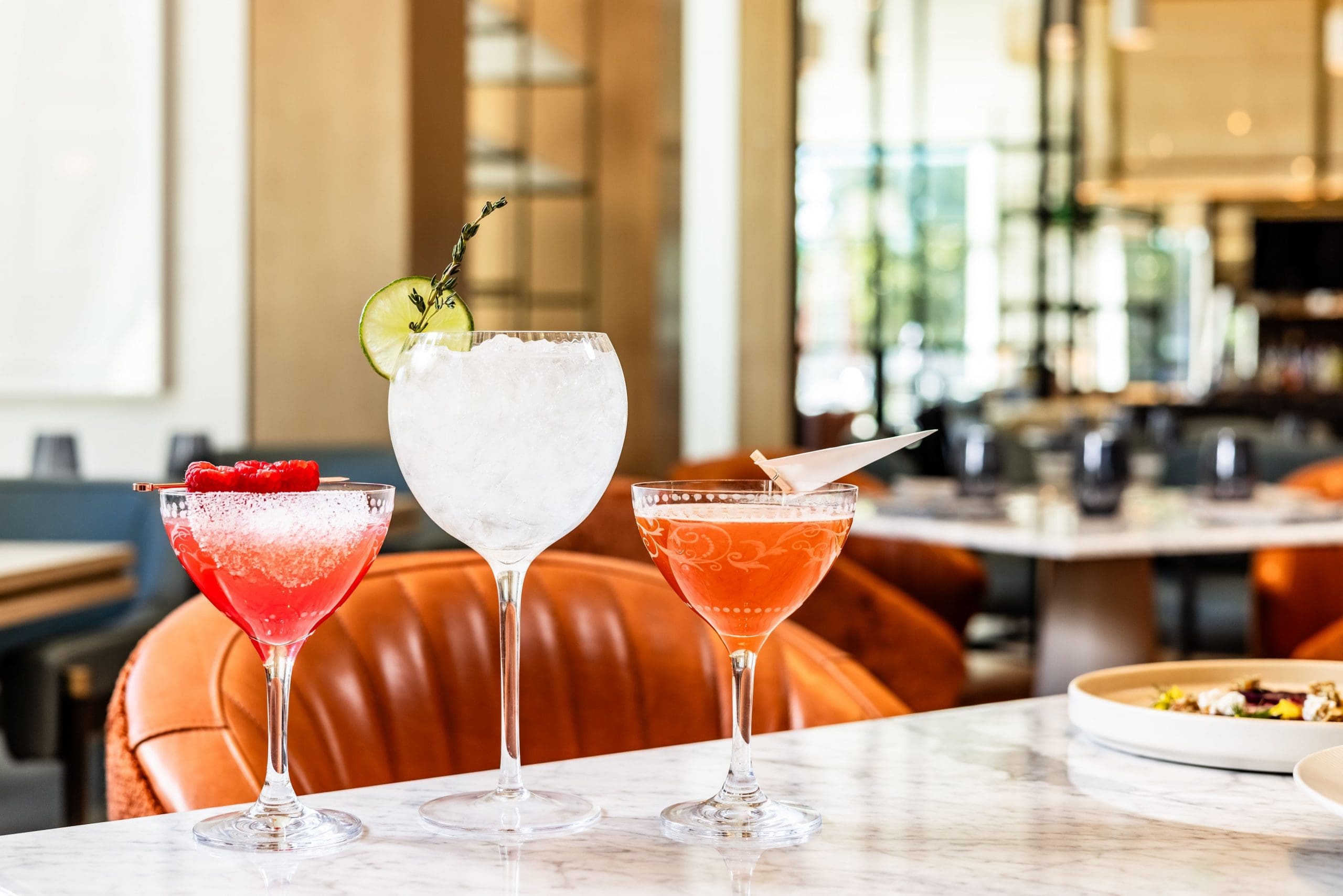 Craft cocktails at Fort Worth's Crescent Hotel include the Negroni tinged Paper Plane.